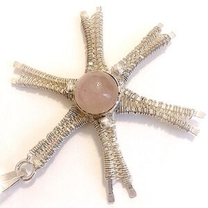 2 1/2 inch, silver wrapped, Rose Quartz, sun burst pendant on silver chain.
